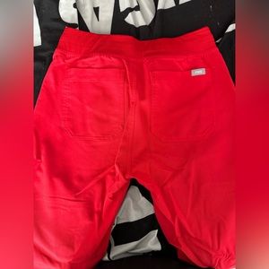 Figs scrub set vibrant red .